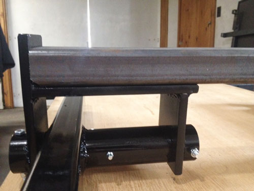 Closeup showing cross beam welded to walking beam