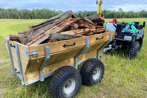 Allen's ATV trailer, fitted with walking beam, and dump feature, hard at work. Photo: Steve Maxwell